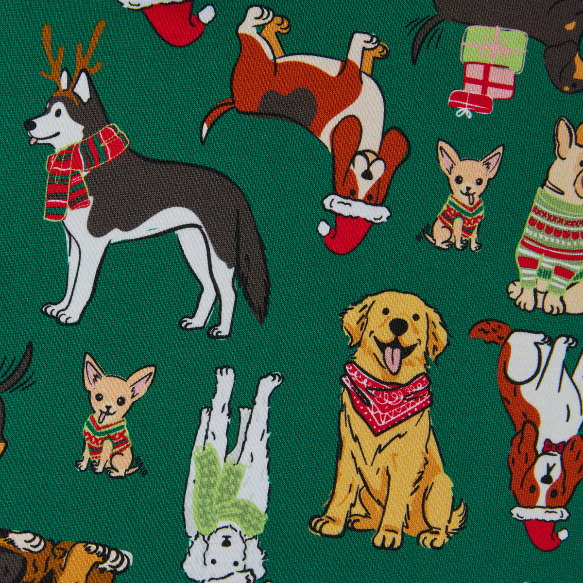 A close-up of a green fabric with a repeating pattern of various dog illustrations wearing Christmas sweaters, scarves, Santa hats, and gifts.