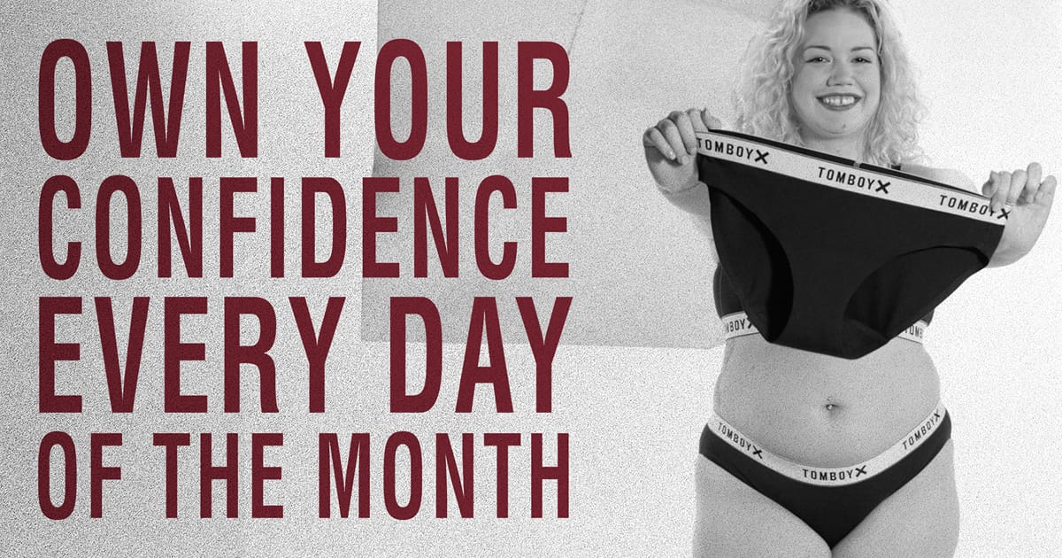 Woman smiling and holding up a pair of first line period underwear with text design "Own your confidence every day of the month"